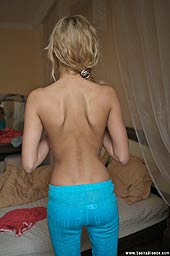 Blonde Sasha Posing Naked In Her Bedroom